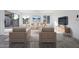 Living room with gray tile floor, beige sofas, and a modern coffee table at 1207 N Velero St, Chandler, AZ 85225