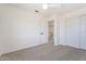 Well-lit bedroom with door to upper loft area and double door closet at 1207 N Velero St, Chandler, AZ 85225