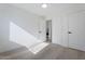 Well-lit bedroom with carpet flooring and access to laundry at 1207 N Velero St, Chandler, AZ 85225