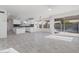 Modern kitchen with white cabinets and gray tile floors at 1207 N Velero St, Chandler, AZ 85225