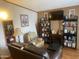 Cozy living room with fireplace, comfortable seating and built-in shelving at 4065 E University Dr # 111, Mesa, AZ 85205