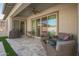 Covered patio with seating area, ceiling fan, and built-in grill at 9746 E Thornbush Ave, Mesa, AZ 85212