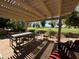 Relaxing patio with pergola, table, chairs, and golf course view at 1034 S Racine --, Mesa, AZ 85206