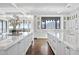 Bright white kitchen with marble countertops, large island, and mountain views at 7046 N 59Th Pl, Paradise Valley, AZ 85253