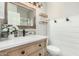 Bathroom with modern vanity, updated fixtures, and a stylish tile shower at 7827 W Donald Dr, Peoria, AZ 85383