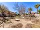 Large backyard with grassy area and cornhole game at 5702 W Windrose Dr, Glendale, AZ 85304