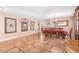 Bright dining room with wood table and chairs, and tile floors at 5702 W Windrose Dr, Glendale, AZ 85304