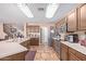 Large kitchen with island, stainless steel appliances and ample counter space at 5702 W Windrose Dr, Glendale, AZ 85304