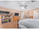 Bedroom with a large bed, built in desk, and ample floor space at 5702 W Windrose Dr, Glendale, AZ 85304