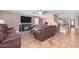 Spacious living room with tile floors, fireplace and stairs at 5702 W Windrose Dr, Glendale, AZ 85304
