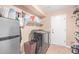 Laundry room with washer, dryer, and extra shelving at 5702 W Windrose Dr, Glendale, AZ 85304