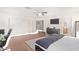 Spacious bedroom with a bed, dresser, and access to another room at 5702 W Windrose Dr, Glendale, AZ 85304