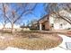 Spacious backyard with covered patio and grassy area at 5702 W Windrose Dr, Glendale, AZ 85304