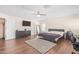 Bedroom with a bed, dresser, and home office setup at 5702 W Windrose Dr, Glendale, AZ 85304
