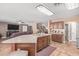 Kitchen boasts an island, stainless steel appliances, and dark wood cabinets at 5702 W Windrose Dr, Glendale, AZ 85304
