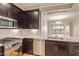 Modern kitchen with stainless steel appliances and granite countertops at 4803 N Woodmere Fairway -- # 2006, Scottsdale, AZ 85251