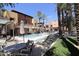 Inviting pool area with lounge chairs and patio umbrellas at 4803 N Woodmere Fairway -- # 2006, Scottsdale, AZ 85251