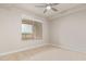 Bedroom with large window, city view, and ceiling fan at 4803 N Woodmere Fairway -- # 2006, Scottsdale, AZ 85251