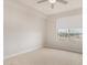 Well-lit bedroom with carpeted floors and large window at 4803 N Woodmere Fairway -- # 2006, Scottsdale, AZ 85251