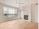 Light and airy living room with hardwood floors and fireplace at 4803 N Woodmere Fairway -- # 2006, Scottsdale, AZ 85251
