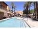Community pool with spacious deck and ample lounge space at 4803 N Woodmere Fairway -- # 2006, Scottsdale, AZ 85251