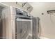 Laundry room with modern washer and dryer at 4803 N Woodmere Fairway -- # 2006, Scottsdale, AZ 85251