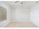 Bedroom with window, carpet, and double doors at 4803 N Woodmere Fairway -- # 2006, Scottsdale, AZ 85251