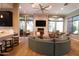 Community room with a large sectional sofa and fireplace at 4803 N Woodmere Fairway -- # 2006, Scottsdale, AZ 85251