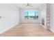 Living room features hardwood floors, fireplace and large window at 4803 N Woodmere Fairway -- # 2006, Scottsdale, AZ 85251