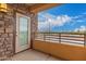 Private balcony with stone wall and distant city views at 4803 N Woodmere Fairway -- # 2006, Scottsdale, AZ 85251