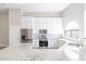 Modern kitchen with white cabinets, granite countertops, and stainless steel appliances at 8753 E Greenview Dr, Gold Canyon, AZ 85118