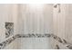 Shower with stylish tile detail and niche at 8753 E Greenview Dr, Gold Canyon, AZ 85118