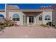 Back exterior view of house with sliding glass doors and stone pathway at 8753 E Greenview Dr, Gold Canyon, AZ 85118