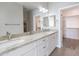 Bathroom with double sinks, granite countertops, and a walk-in closet at 8753 E Greenview Dr, Gold Canyon, AZ 85118