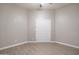 Bedroom with double doors and wood-look tile floor at 8753 E Greenview Dr, Gold Canyon, AZ 85118