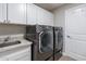 Laundry room with LG washer and dryer, cabinets, and sink at 8753 E Greenview Dr, Gold Canyon, AZ 85118