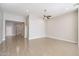 Spacious living area with tile floors and a ceiling fan at 8753 E Greenview Dr, Gold Canyon, AZ 85118