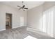 Spacious carpeted bedroom with ceiling fan and access to closet at 8753 E Greenview Dr, Gold Canyon, AZ 85118