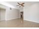 Bright living room with tile floors and a ceiling fan at 8753 E Greenview Dr, Gold Canyon, AZ 85118