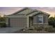 Two-story house with a gray exterior, two-car garage, and desert landscaping at 4107 E Ghost Flower Ln, San Tan Valley, AZ 85140