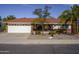 Brick ranch home with white garage door and red tile roof at 10832 E Keats E Ave, Mesa, AZ 85209