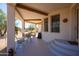 Covered patio with seating area and access to the house at 30218 N 162Nd Way, Scottsdale, AZ 85262