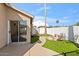 Backyard with fire pit, sitting area, and grassy lawn at 6617 E Northridge St, Mesa, AZ 85215