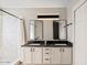 Modern bathroom with double vanity, large mirror, and shower at 6617 E Northridge St, Mesa, AZ 85215