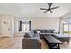 Spacious living room with large sectional sofa and wood flooring at 6617 E Northridge St, Mesa, AZ 85215