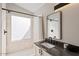 Updated bathroom with walk-in shower and single vanity at 6617 E Northridge St, Mesa, AZ 85215