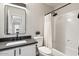 Clean bathroom with bathtub, single vanity, and shower at 6617 E Northridge St, Mesa, AZ 85215