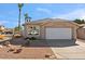 Single story home with attached garage and desert landscaping at 6617 E Northridge St, Mesa, AZ 85215