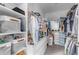 Large walk-in closet with shelving and drawers at 44395 W Bailey Dr, Maricopa, AZ 85138