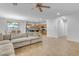 Open concept living room with a view into the kitchen at 44395 W Bailey Dr, Maricopa, AZ 85138